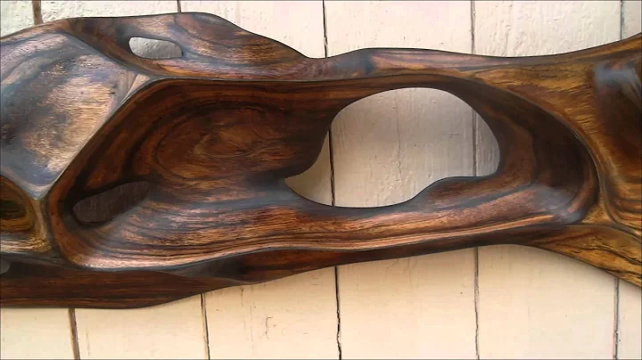 Reclining lady, a Koa wood sculpture by Derek Bencomo
