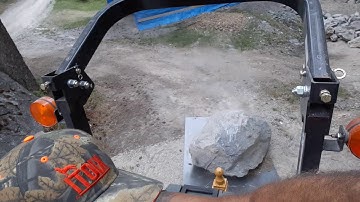 Small video of Large rock on the plate steel skidded. Pulled by the Kioti tractor