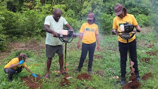 My father teaching me how to use this digging machine \/\/ planting grass for cow