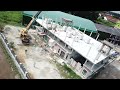 Supermom Home Office : Crane uplifting bricks to second floor
