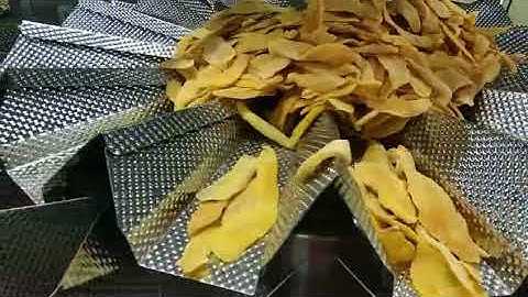 Rotary packing line for sliced dried mango