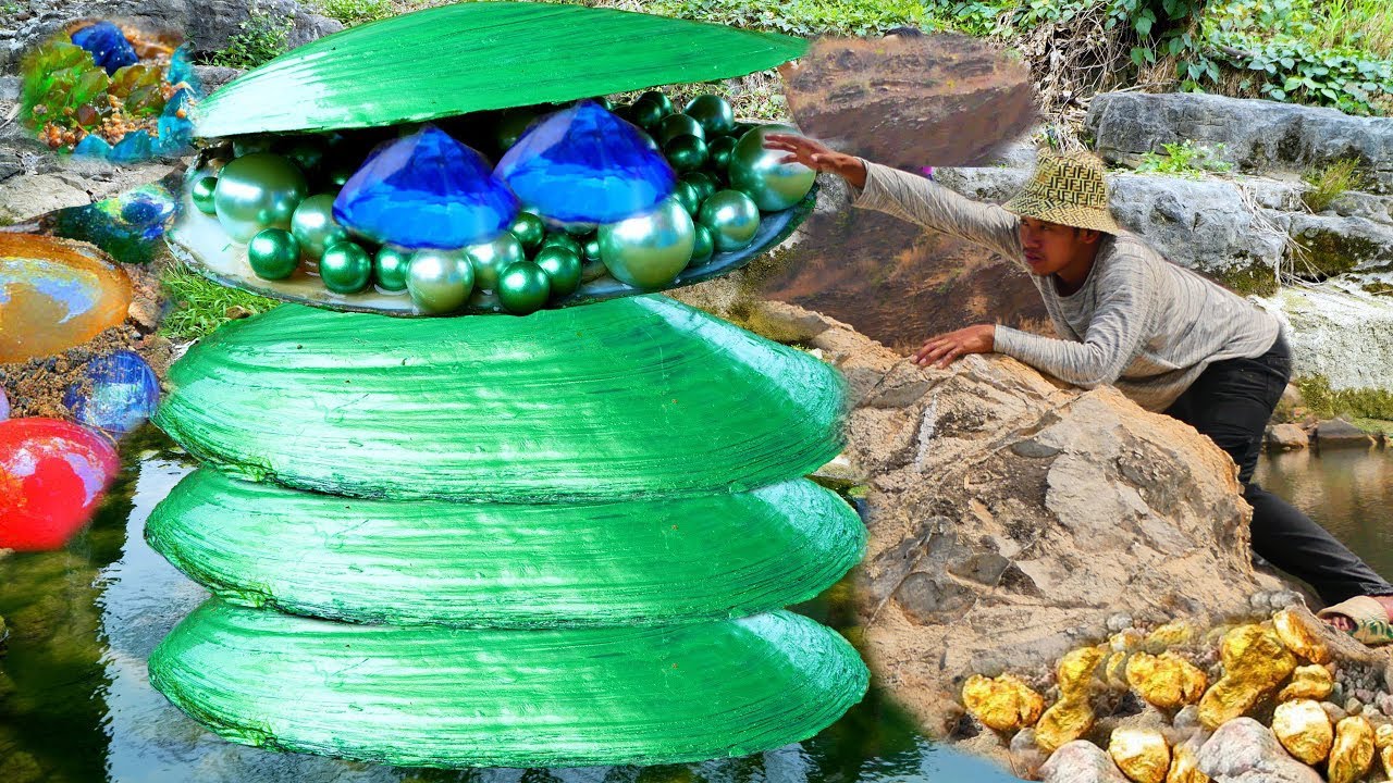 The boy opened the huge claw and found a beautiful jewelry box with gold pearl treasures.