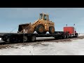 buying a front end loader hauling it home