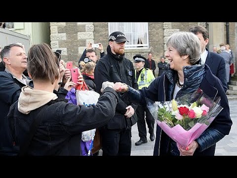 May fist bumps and poses for selfies during Salisbury vist