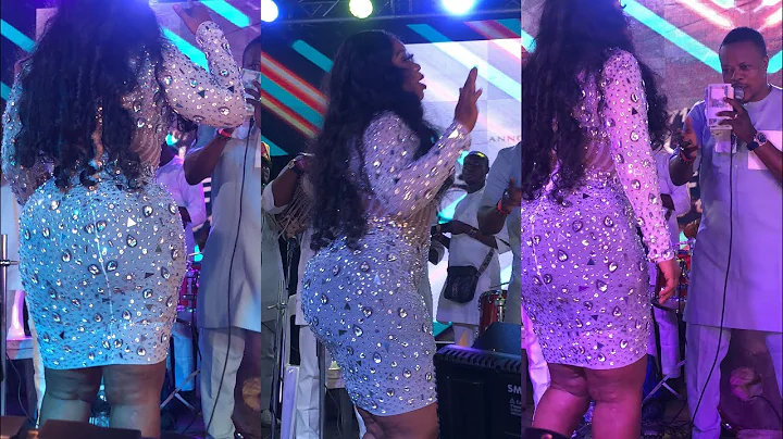 Wunmi Toriola on stage with her confusing figure 8 with Lanre Teriba, spray him bundles of cash.