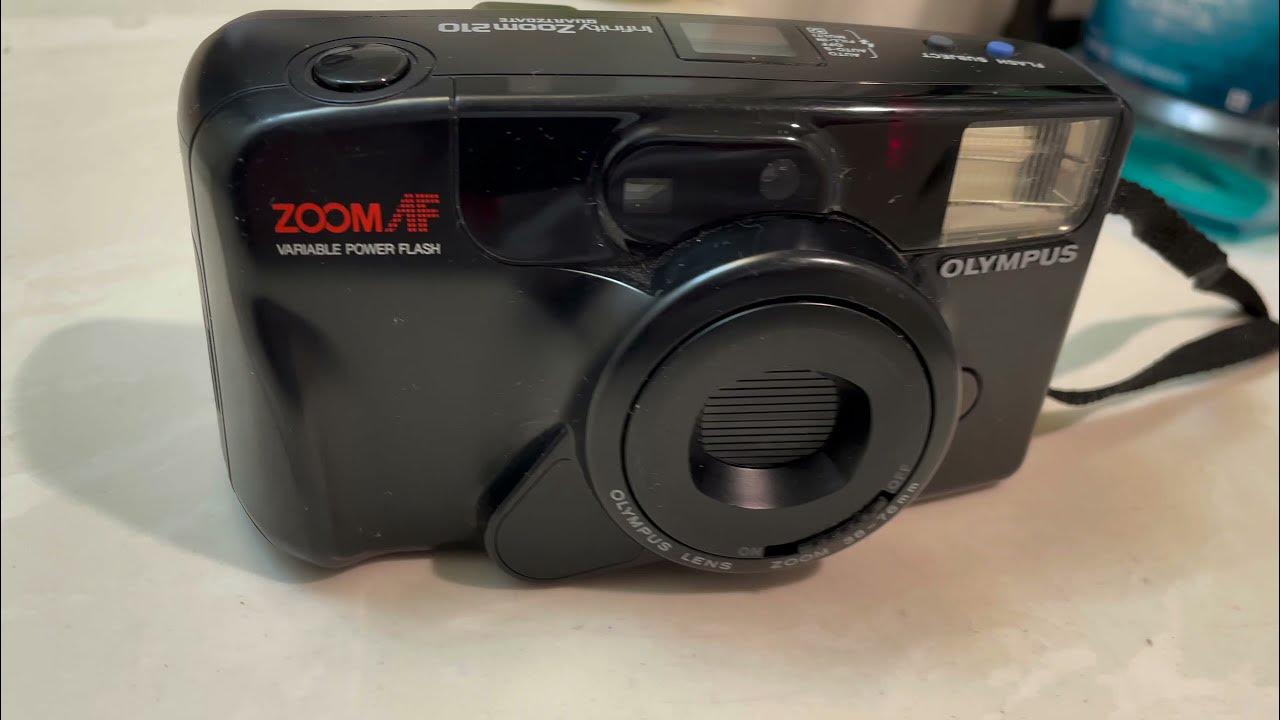 OLYMPUS INFINITY ZOOM 210 QUARTZ DATE 3876MM AUTO FOCUS ZOOM FILM