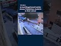 Armed illegal Israeli settler chases Palestinian students to their school