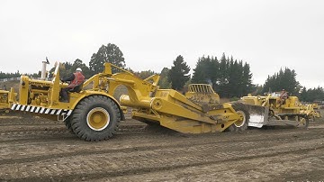 Caterpillar D8H Dozer Push Loading a Caterpillar DW21 Scraper