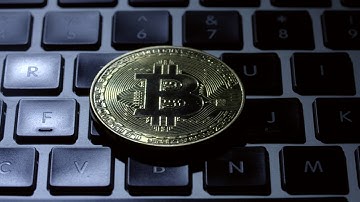 Gold coin bitcoin on keyboard | Stock Footage | Creative Commons Central