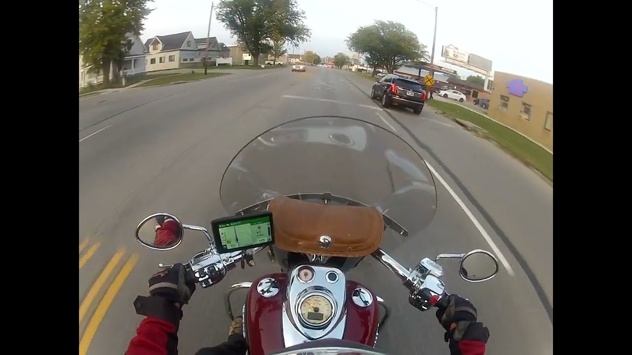 Indian motorcycle leaving bike night riding thru Cedar Rapids Iowa going North