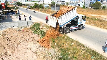 Dump truck 5T unloading soil filling up with Skill operator Bulldozer Working push soil fill