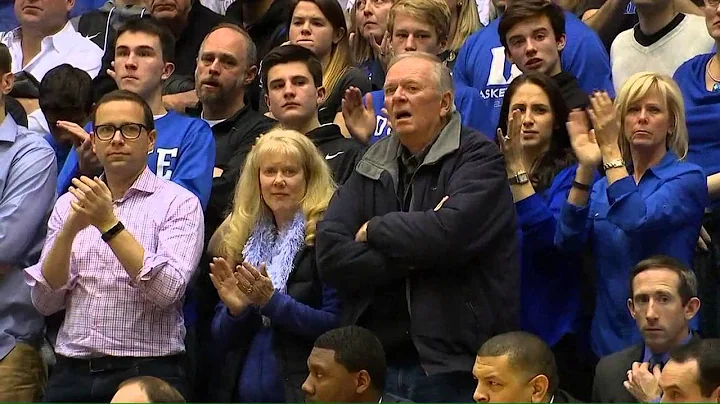 Larry Stogner greeted by Coach K at game