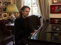 Andrea bocelli plays the piano