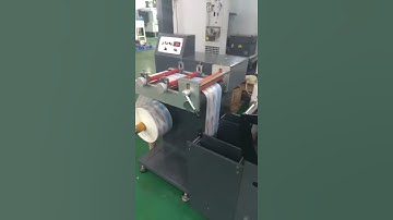 Roll to sheet cutting machine