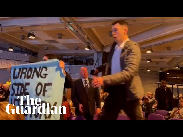 'Barclays funds climate chaos': bank's AGM disrupted by climate protesters class=