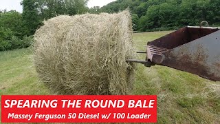 Spearing The Round Bale - Massey Ferguson Model 50 Diesel &amp; 100 Loader