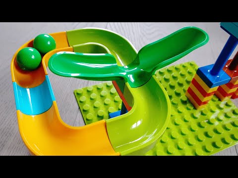 Satisfying building blocks Marble run with swings, a sound slide and funnels