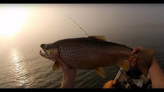 Kayak trout fishing Lake Ontario in the fog