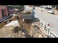 Canal Slope Foundation Building Strong Excavator Pushing Rock And 5 Tons Dump Truck