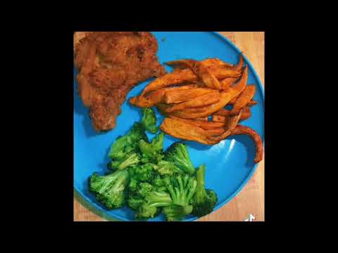 Cooking dinner - sweet potato fries, fried porkchop, and broccoli