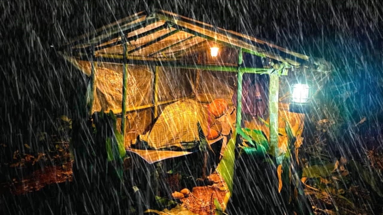 Building a Warm Bushcraft Shelter // in the middle of a VERY HEAVY ...