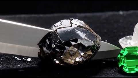 Ultra-sharp knife slices through obsidian, quartz, emerald, and diamond in slow motion.