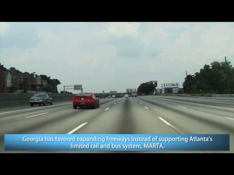 This video follows I-85 in Metro Atlanta from Pleasantdale Rd. (Exit 96) in northeast DeKalb County to North Ave. (Exit 249D) in Downtown Atlanta near Georgia Tech on the Downtown Connector with I-75. In this video you'll see one of the largest stack interchanges and one of the largest, most congested roads in the southeast. Once known primarily for its handsome homes on large plots of lush green land, this city has transformed itself into a gusty metropolis. It has a dizzying assortment of nightclubs, blues bars, cafes, shops, and restaurants ranging from teahouses to palaces of culinary art that regularly make "best in the nation" lists. Every Fortune 500 firm is represented here and Atlanta has pushed its population close to 6 million people as of 2009 estimates (the city proper is almost 500000), swelling both inside the perimeter and its suburbs with scientists, high-tech workers, and creative types lured by the energy of a city on the move. This is the center of the New South, but with gusto!