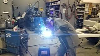 Trevor welding new pintle eye on trailer.