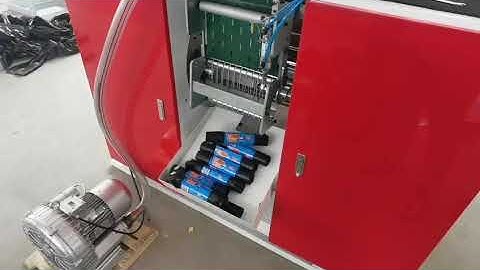 ribbon throught drawstring  garbage bag making machine with auto label device .sold to France