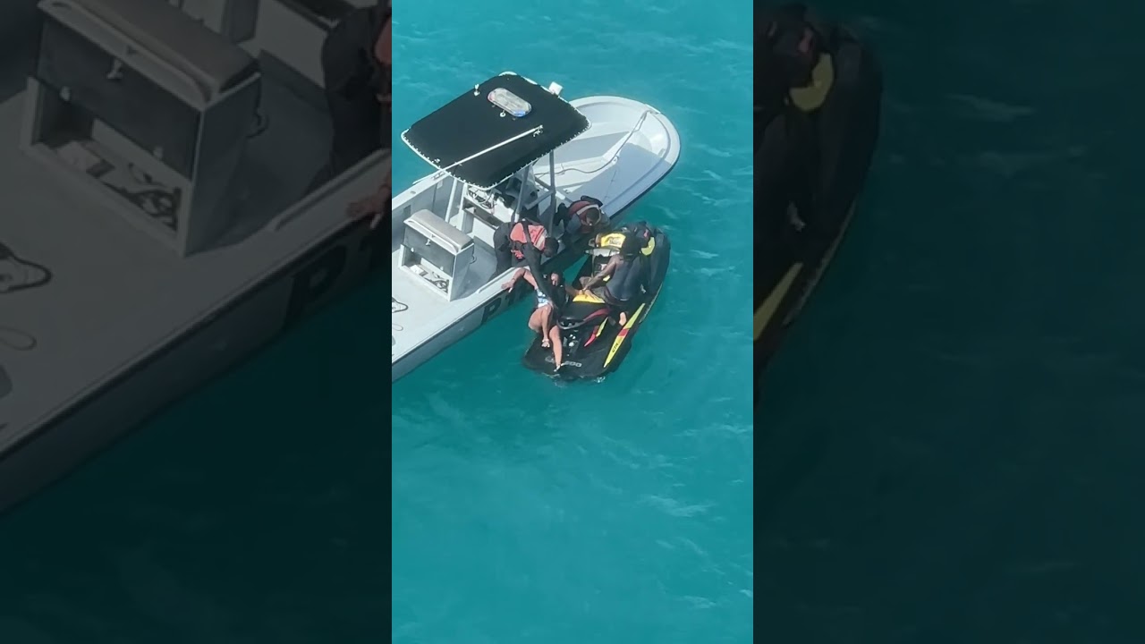 Couple Struggles to Stay Balanced on Jet Ski - 1409935-1