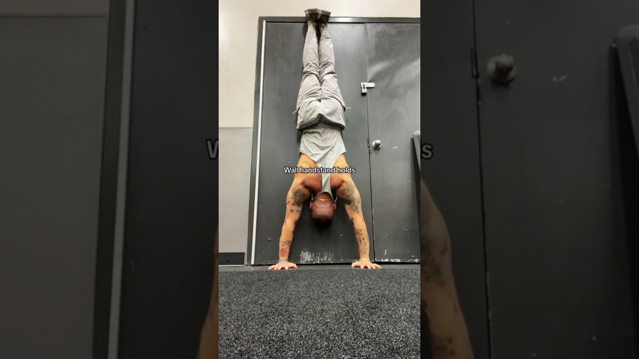 What benefits does wall handstand holds have?