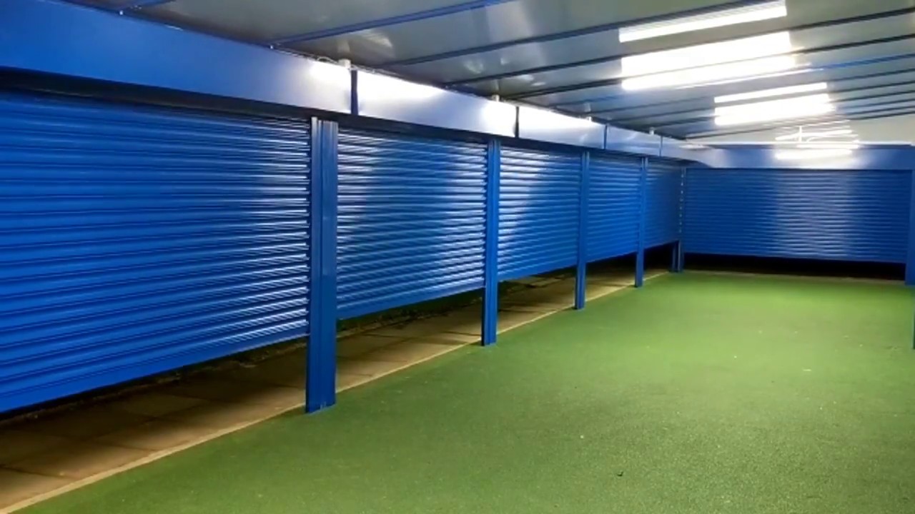 Secure Roller Shutters on a Wall Mounted Canopy Opening and Closing
