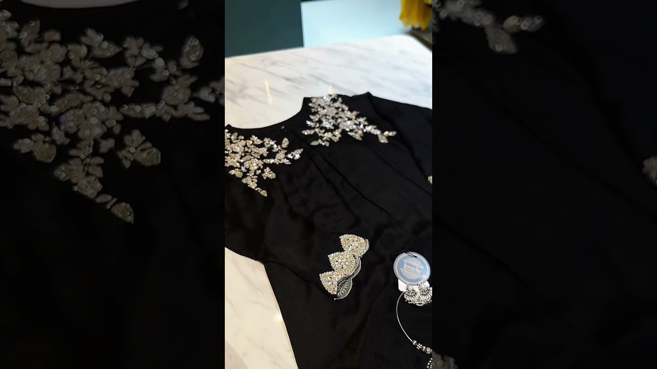 Elegance in black adorned with intricate crystal embellishments. 