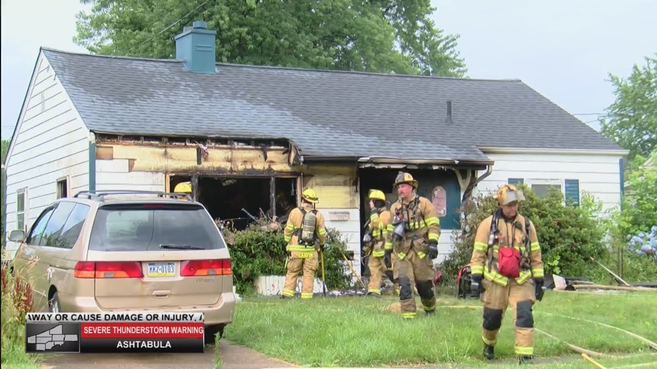 Crews battle house fire on West 35th Street - YouTube