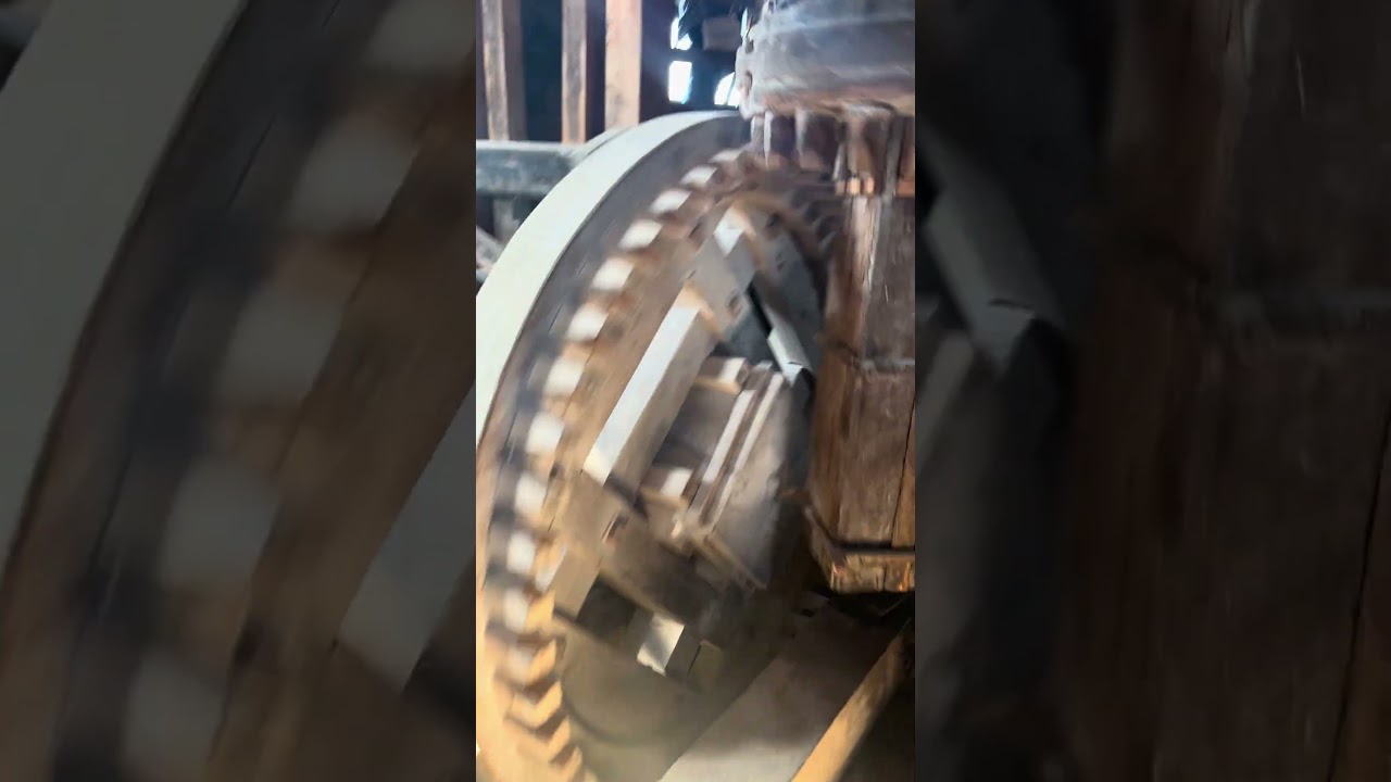 Inside of a working Dutch windmill - it is milling corn