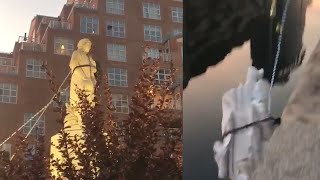 Baltimore protesters pulled down a statue of Christopher Columbus and threw it into the city's Inner Harbor., From YouTubeVideos