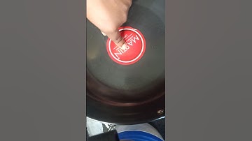 Easily remove sticker from new non stick pan #kitchentips #tips #shorts