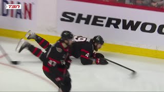 Nick Holden unwittingly hits his own teammate, Scott Sabourin