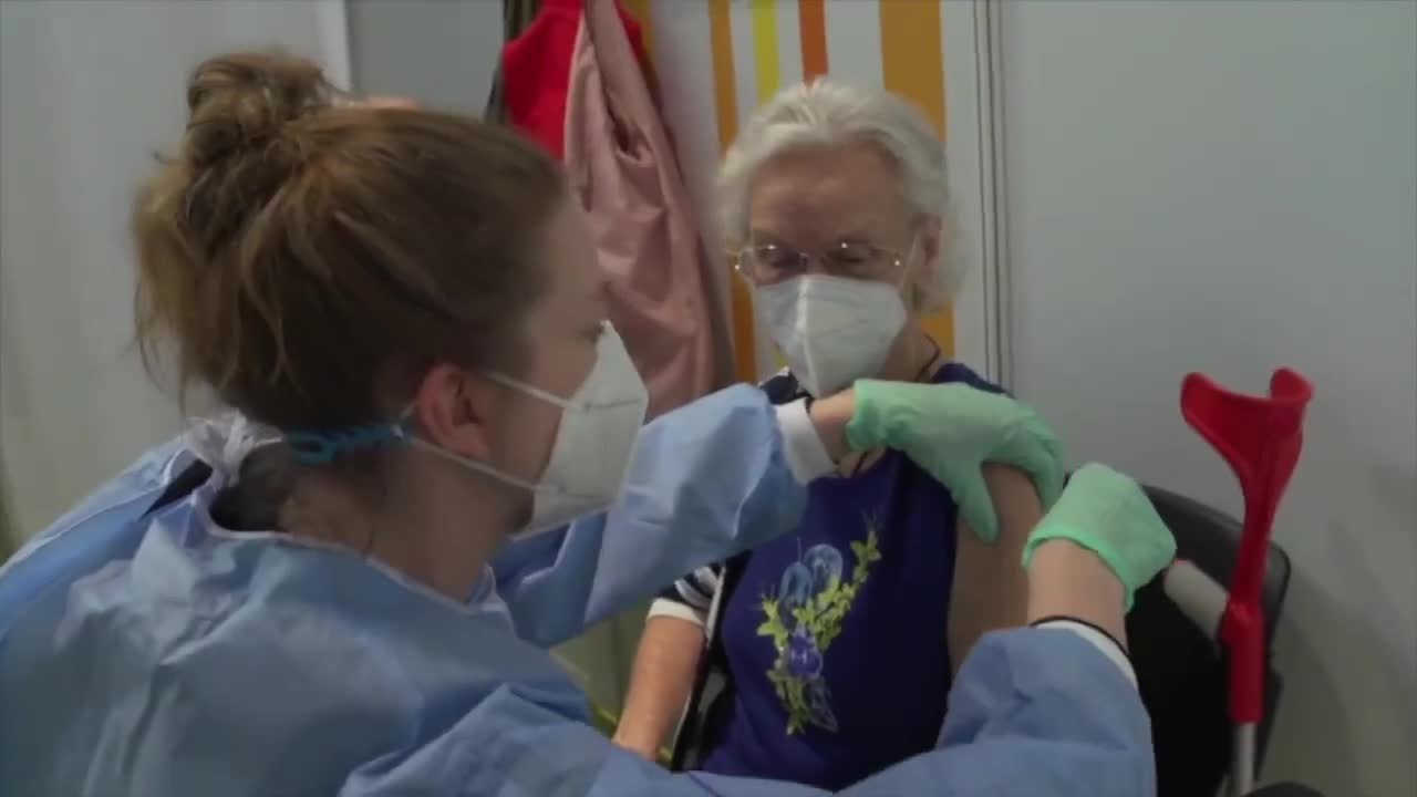 People wondering whether to get new COVID booster vaccine - YouTube