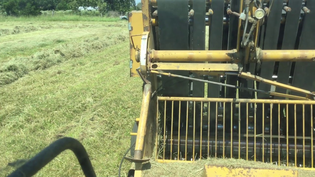 Baling hay 1086 IH and Vermeer 605F
