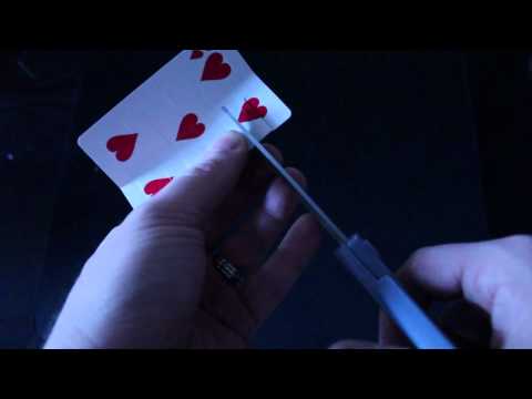 Cut a hole in a playing card big enough that your head can fit through