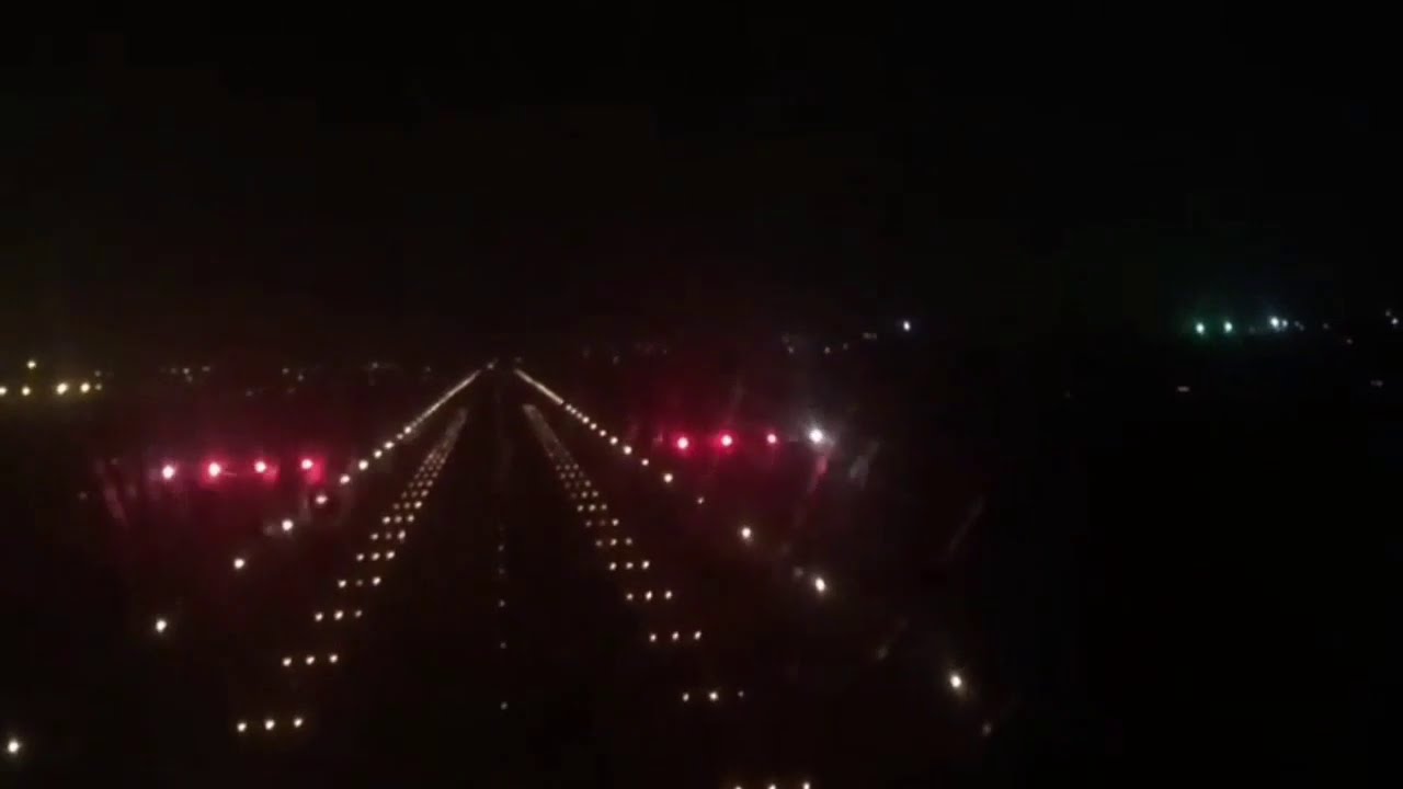 Night landing view of Karachi Airport from flight deck
