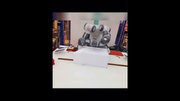 Gift wrapping robot arms