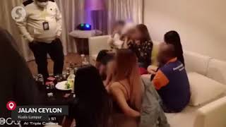 Malaysia police on raid.