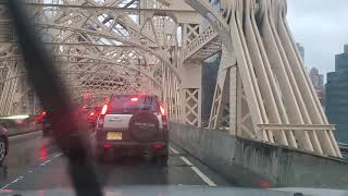 Queensbridge NYC 59th Street Bridge to Manhattan. Rush Hour traffic in the Rain.