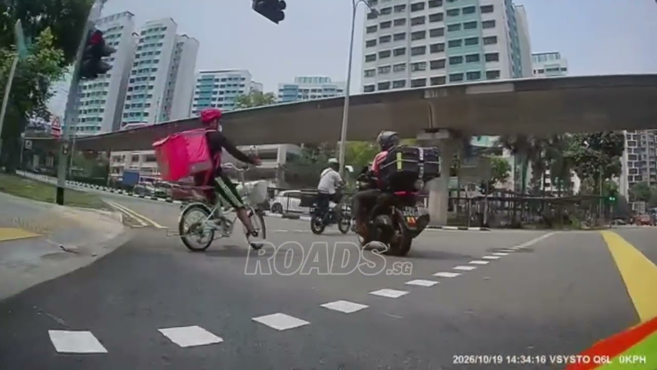 A biker crossed the road while pedestrians had the right of way