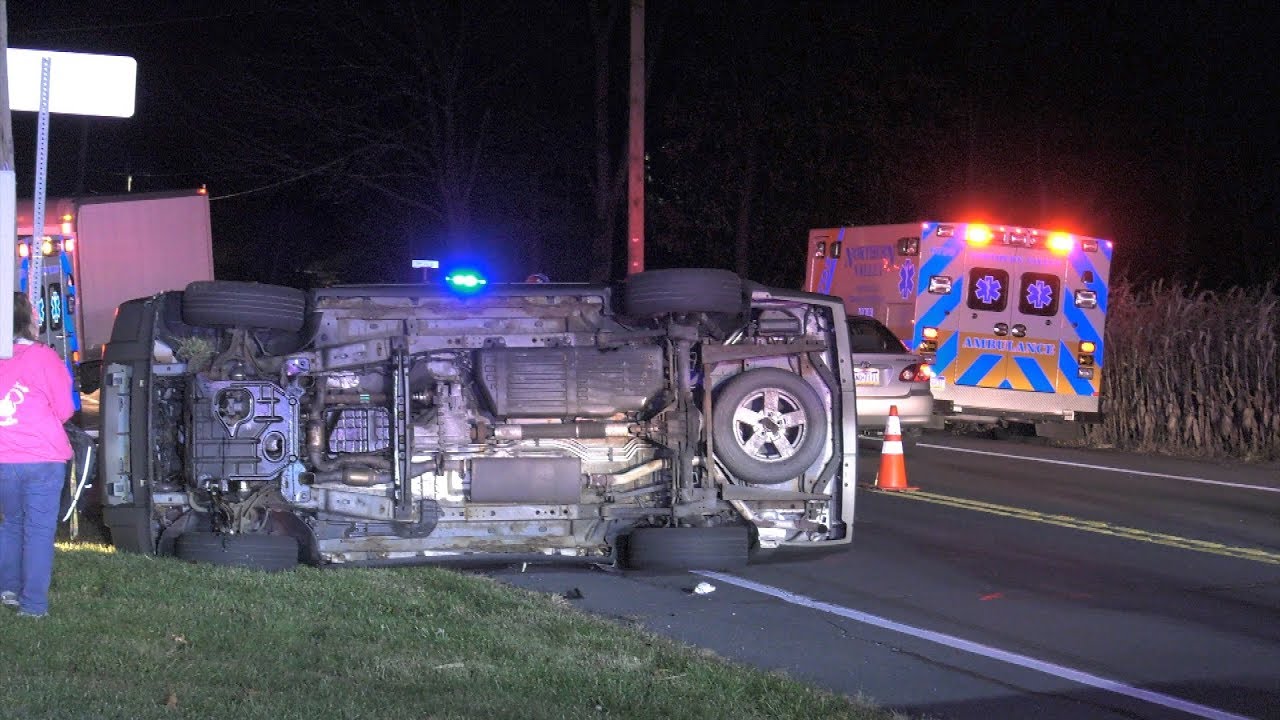 INJURY CAR CRASH with one car on its side on PA Route 145 North
