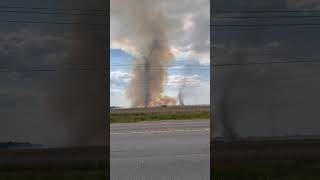 Rare moment two fiery dust devils spotted over farmland
