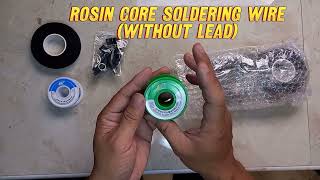 Unpacked Adhesive Cloth tape, soldering wire, mini drill chuck, blow torch