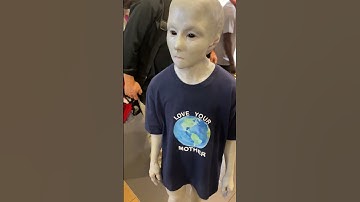Person dressed as an alien walks around NYC mall